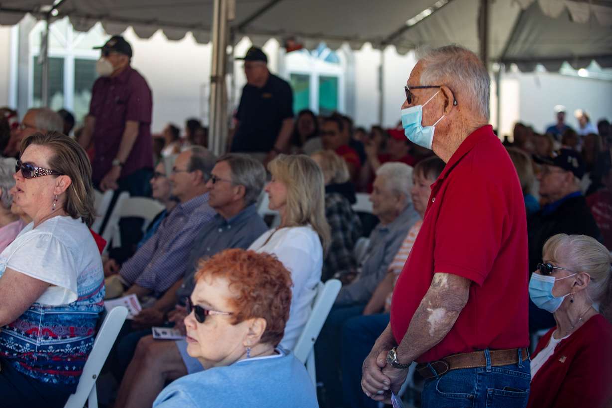 Veterans stand as their anthems play at Larkin Sunset Gardens Cemetery in Sandy on Monday, May 31, 2021.