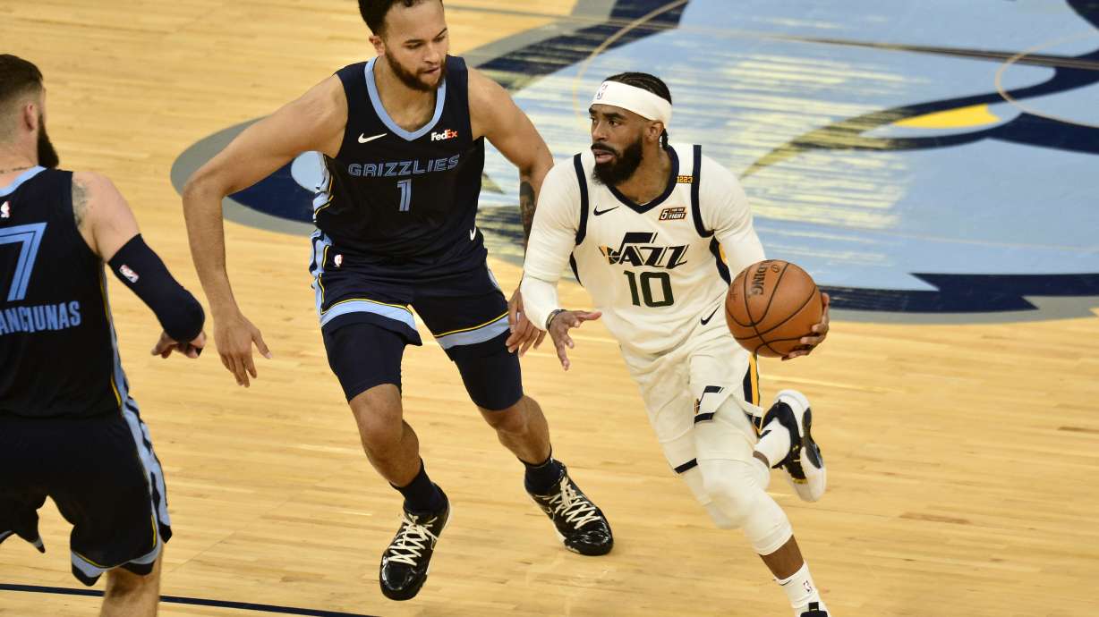 Utah Jazz guard Mike Conley (10) handles the ball ahead of Memphis Grizzlies forward Kyle Anderson (1) in the second half of Game 4 of an NBA basketball first-round playoff series Monday, May 31, 2021, in Memphis, Tenn. (AP Photo/Brandon Dill)