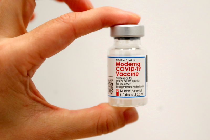 FILE PHOTO: A healthcare worker holds a vial of the Moderna COVID-19 Vaccine at a pop-up vaccination site operated by SOMOS Community Care during the coronavirus disease (COVID-19) pandemic in Manhattan in New York City, New York, U.S., Jan. 29, 2021. REUTERS/Mike Segar