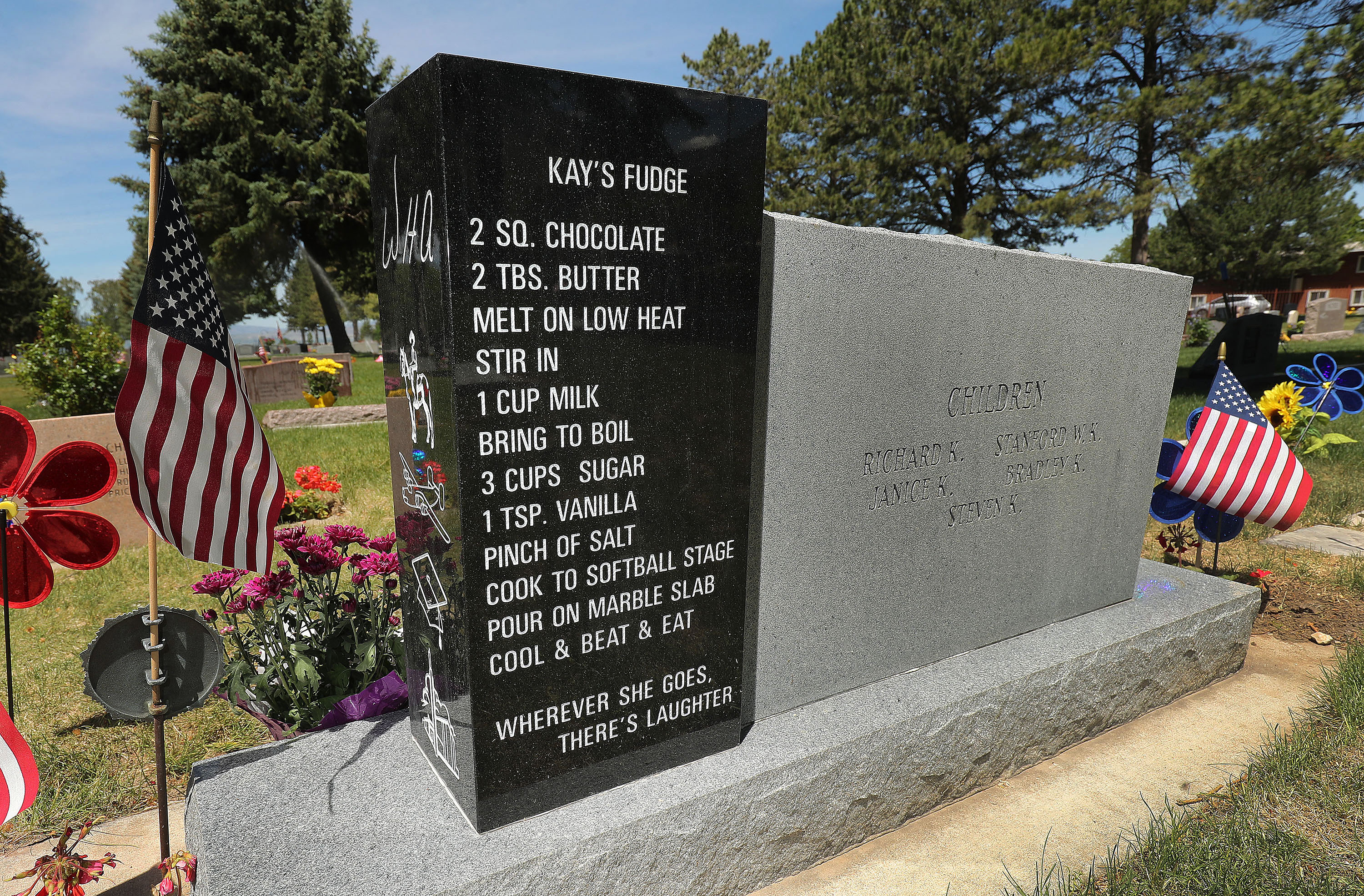 The headstone of Wade and Kathryn "Kay" Andrews, pictured in the Logan Cemetery in Logan on Tuesday, June 1, 2021, features Kathryn Andrews' fudge recipe on the back.