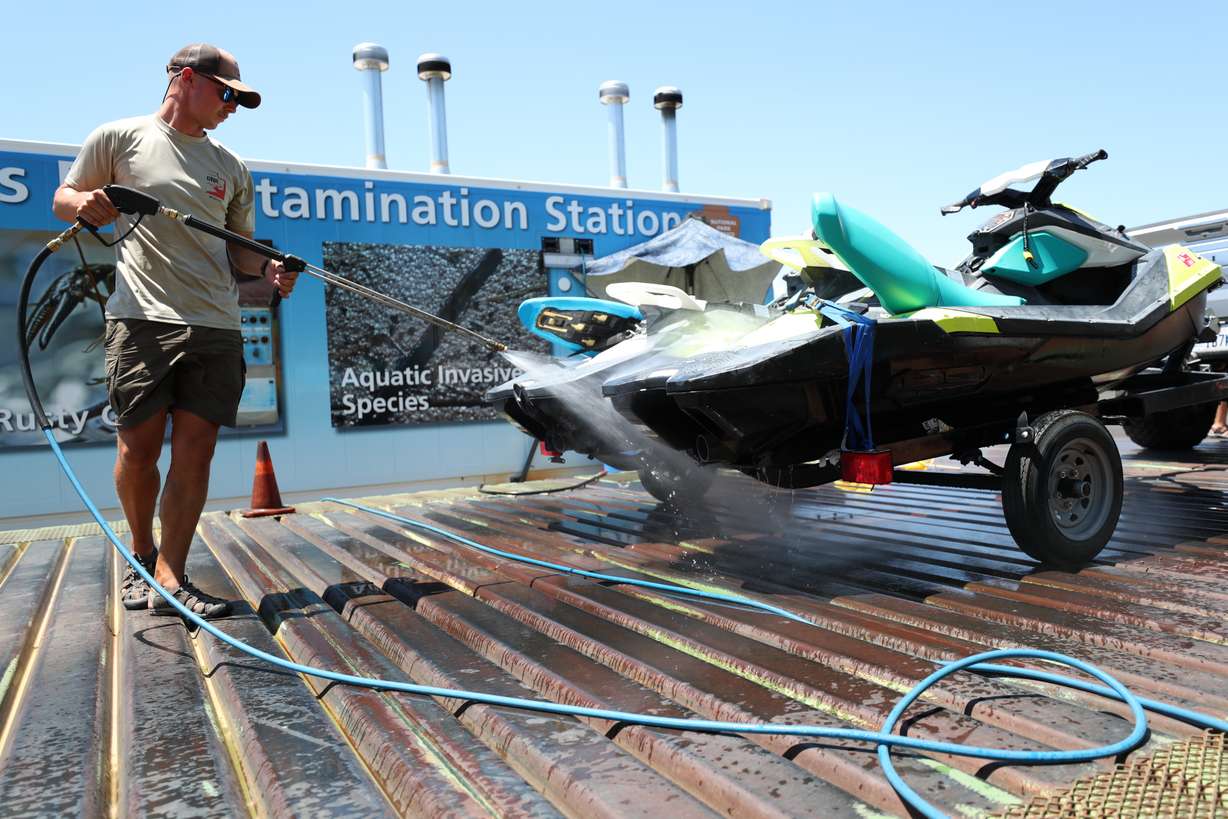 An undated photo of a Utah Division of Wildlife Resources officials spraying down a watercraft at a decontamination station in Utah.