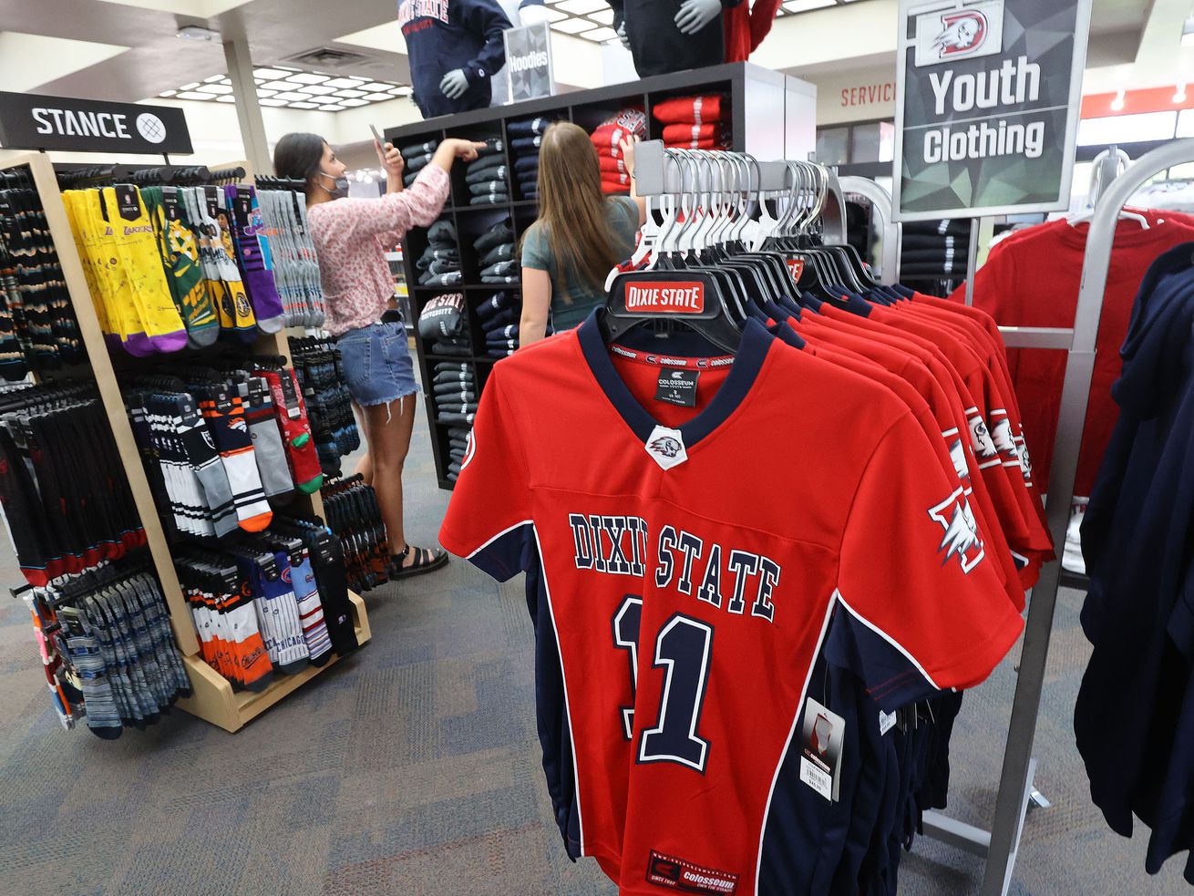 People shop for clothing at Dixie State University in
St. George on Friday, April 9, 2021. The Dixie State University
board of trustees’ executive committee has began a name change
process for the university.
