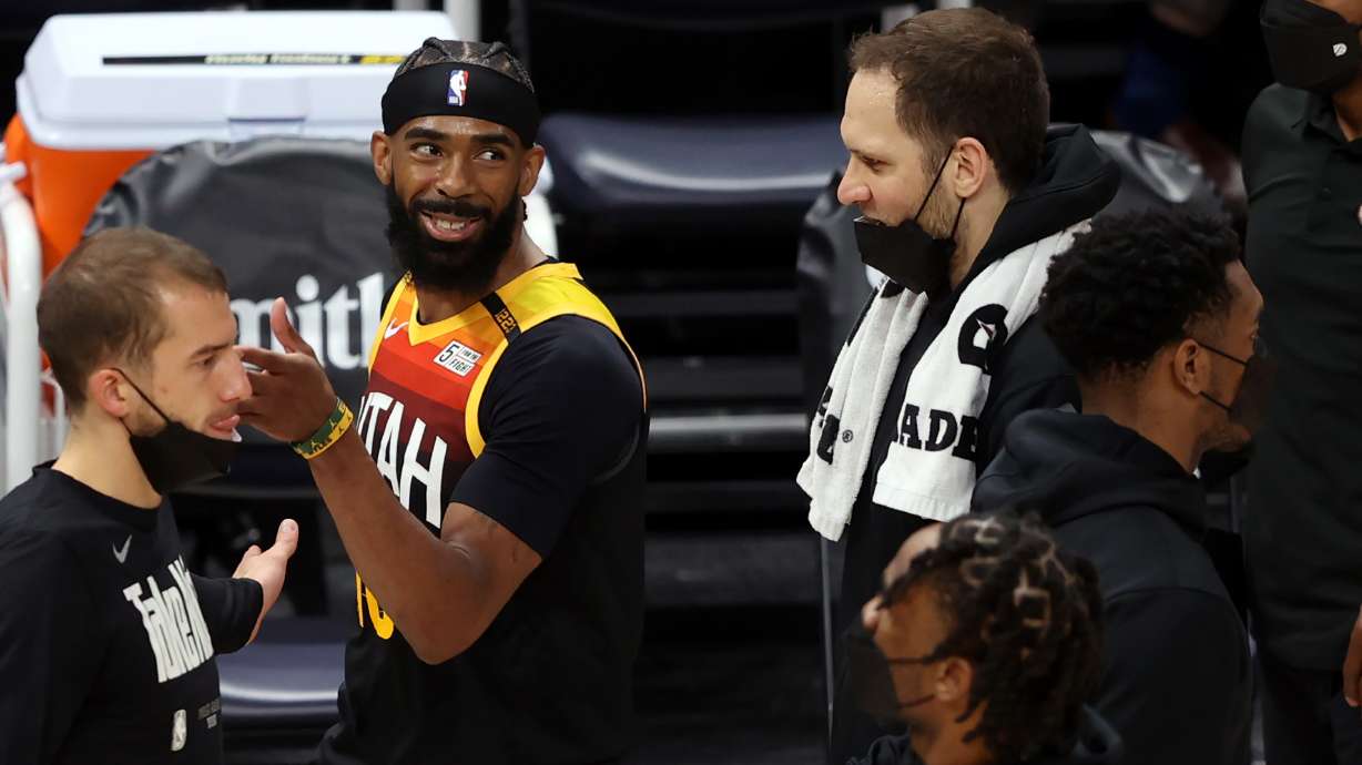 Utah Jazz guard Mike Conley (10) smiles as he and teammate Utah Jazz forward Bojan Bogdanovic (44) talks during a timeout as the Utah Jazz and the Memphis Grizzlies play in game 5 at Vivint Arena in Salt Lake City on Wednesday, June 2, 2021.