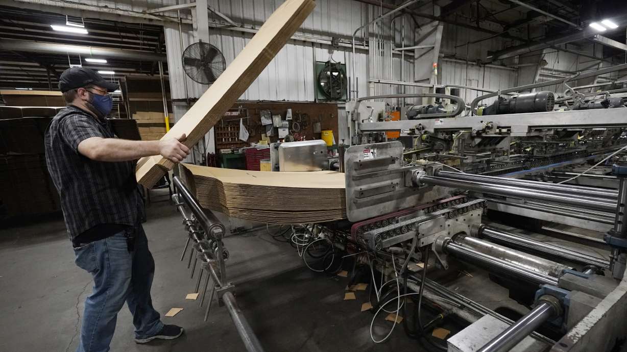 Rob Bondurant, a supervisor at Great Southern Industries, a packaging company, loads up a finishing machine in the Jackson, Miss., facility, Friday, May 28, 2021. The lack of workers has forced some supervisors to assume additional duties. Charita McCarrol, human resources manager at the company, cites the abuse by some people of the $300-a-week federal supplement for people who lost their jobs during the COVID-19 pandemic, as well as other programs that offered extended support for the unemployed, with providing a soon to end financial staple. She also cited that for some people, a steady paycheck and benefits like health care, are not enough of an incentive to pass up the expiring benefits. (AP Photo/Rogelio V. Solis)