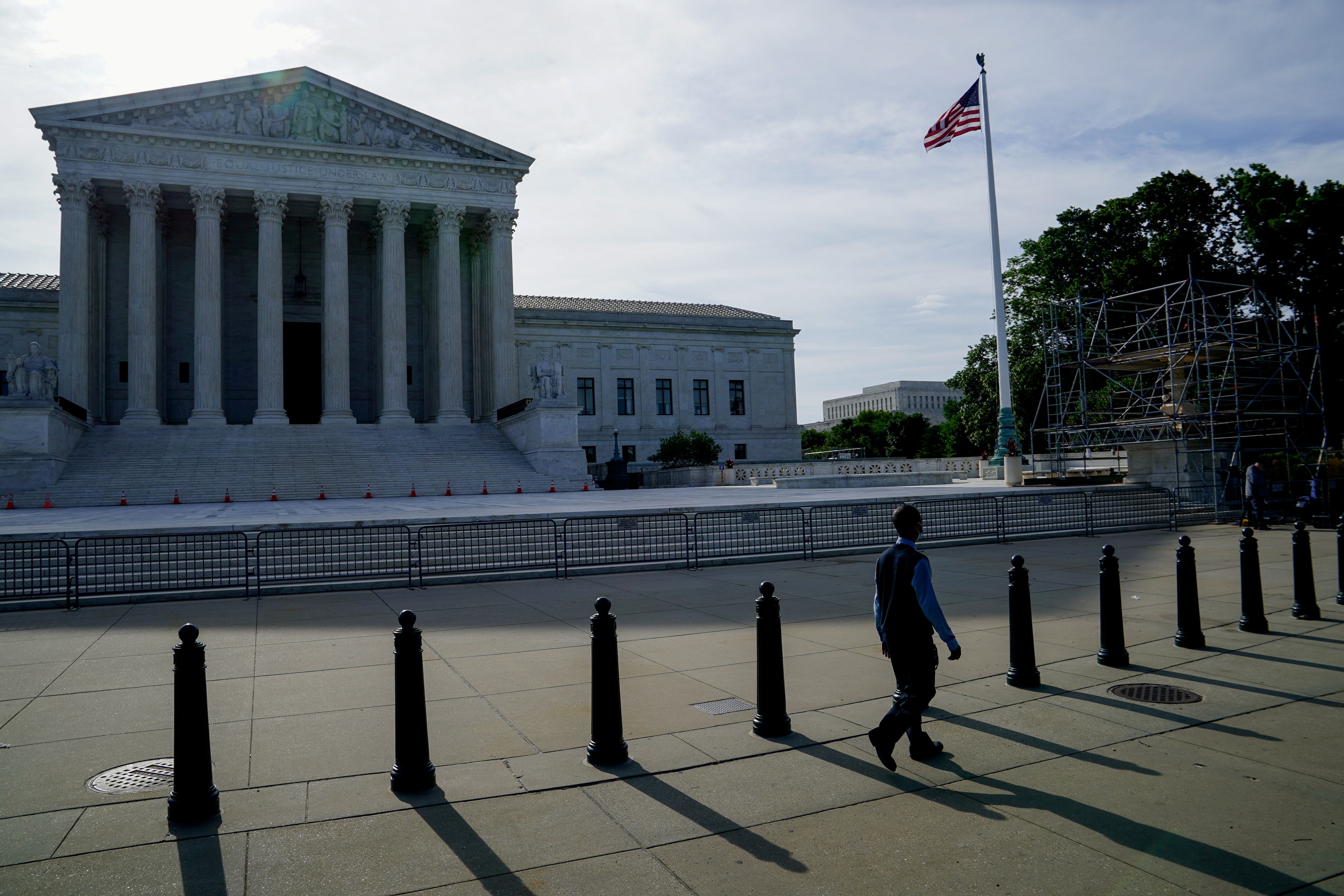FILE: People walk past the U.S. Supreme Court in Washington D.C., U.S., June 1, 2021. Reuters/Erin Scott.