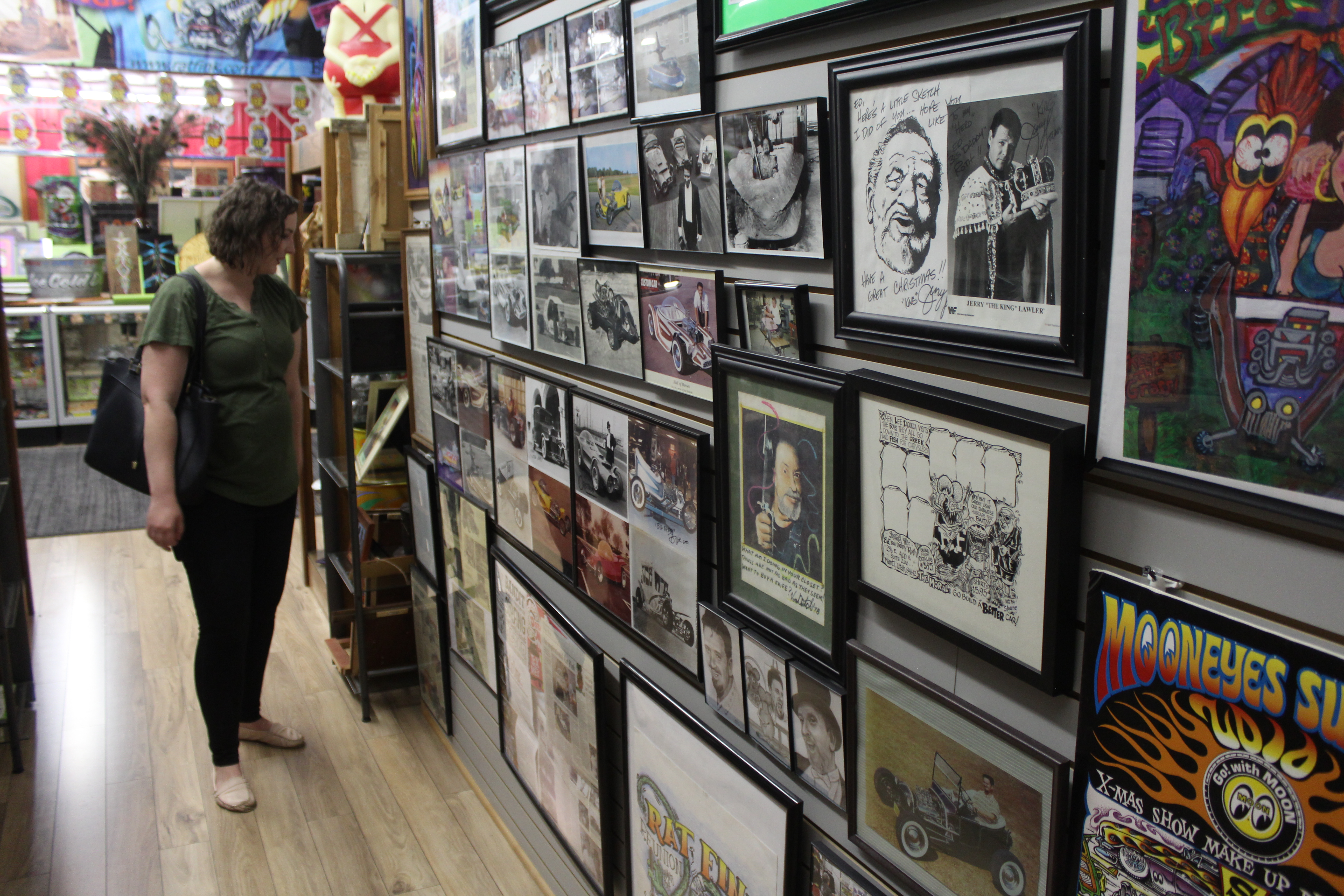 Aimee Cobabe checks out the art and news on display at the Rat Fink Museum at the 2019 reunion.
