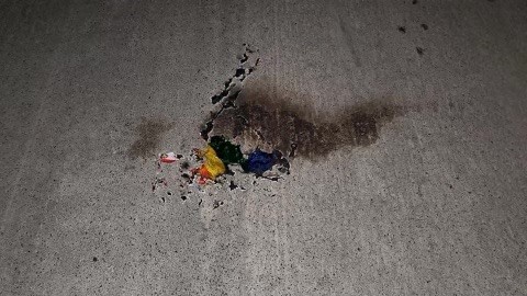 Police are investigating a possible hate crime after a rainbow Pride flag supporting the LGBTQ+ community was burned and a derogatory note left behind. 