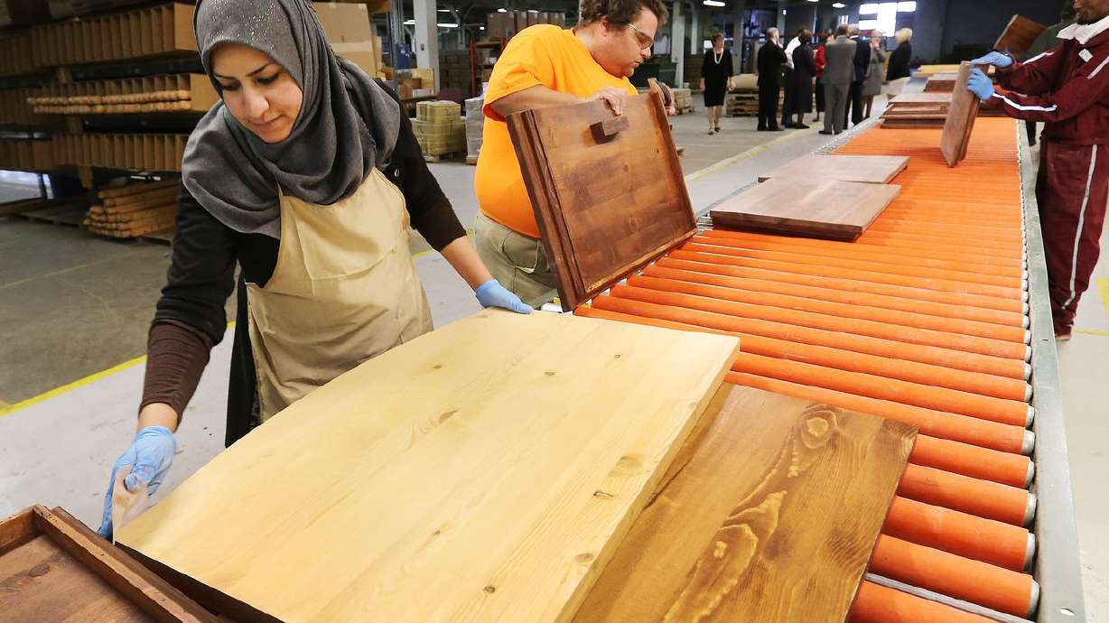 Ragaa Hamad builds furniture at Deseret Manufacturing
in Salt Lake City on Tuesday, Oct. 18, 2016. Deseret Manufacturing
products are made by refugees and often donated to refugees who
resettle in the United States.