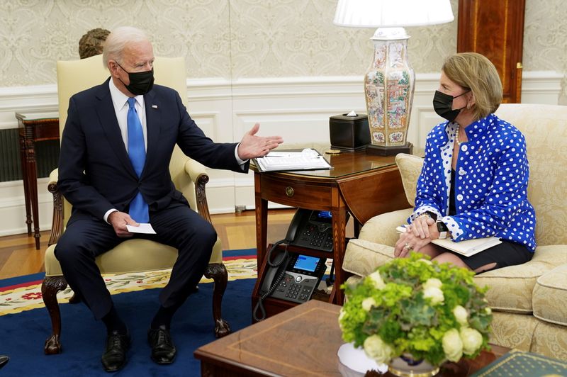 FILE PHOTO: U.S. President Joe Biden gestures toward Sen. Shelley Capito, R-WV., during an infrastructure meeting with Republican Senators at the White House in Washington, U.S., May 13, 2021. REUTERS/Kevin Lamarque