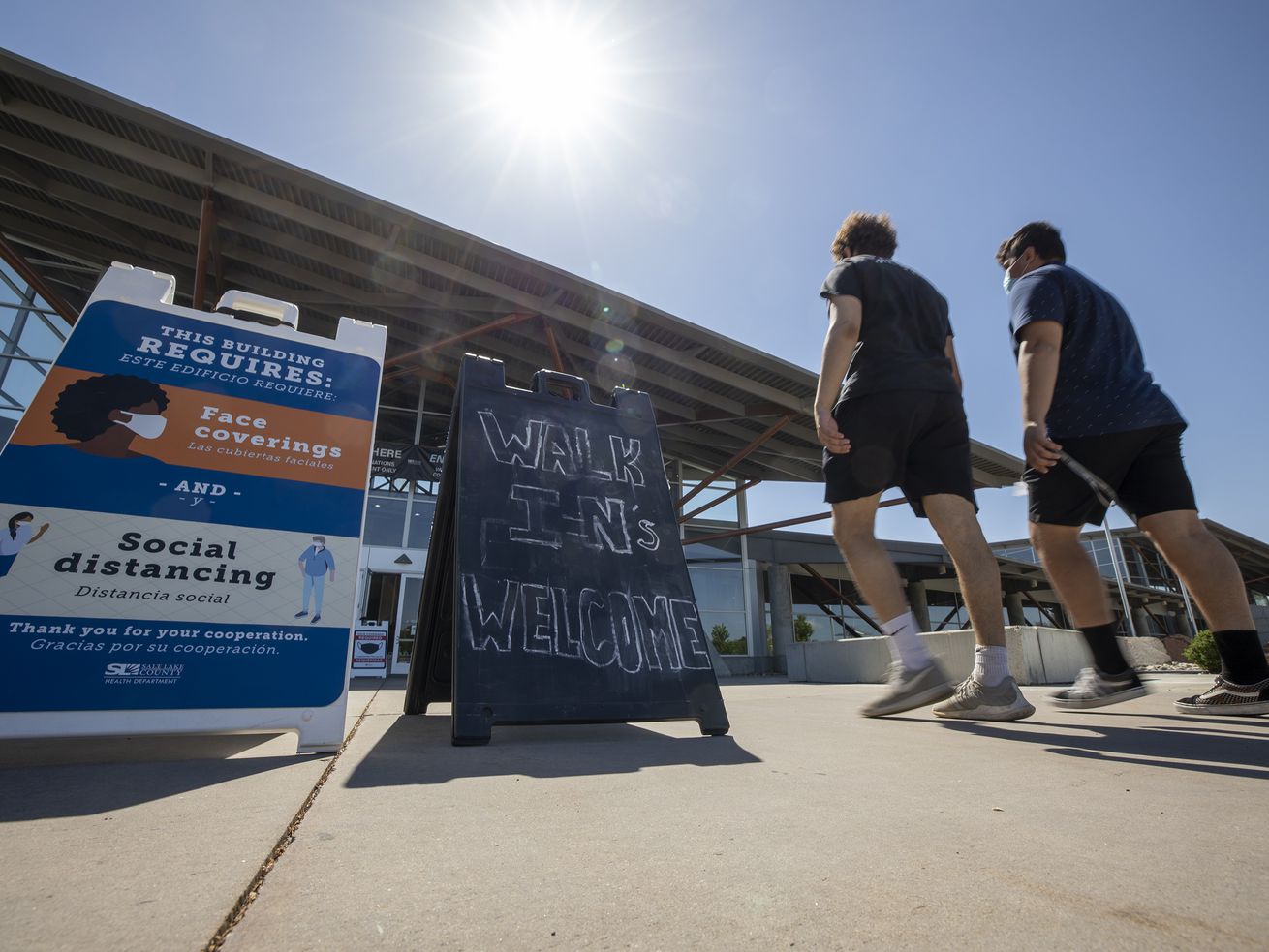 People arrive at the Mountain America Exposition Center in Sandy to receive COVID-19 vaccinations on Tuesday, May 18, 2021. While other states may be offering residents who get vaccinated against COVID-19 an increasingly wide range of incentives, Utah is not.