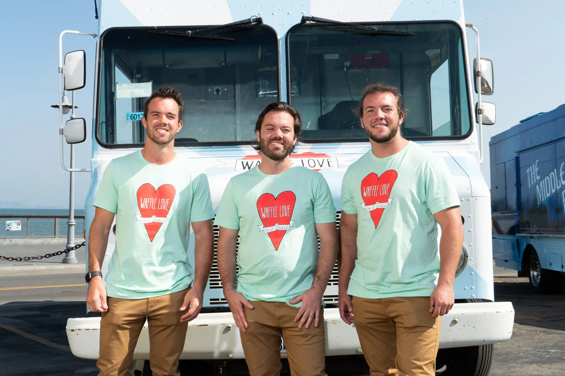 Brothers Steve, Adam and Jared Terry pose for a photo in front of a Waffle Love food truck. The Utah-born business is competing on Food Network’s “The Great Food Truck Race: All Stars,” which premieres June 6. 
