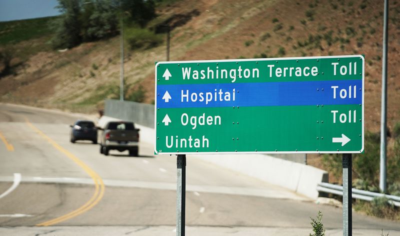 Motorists travel along Adams Avenue Parkway in Washington Terrace on Thursday, May 20, 2021. The toll road
connects U.S. 89 to I-84.