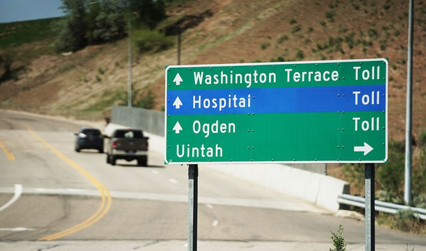 Motorists travel along Adams Avenue Parkway in Washington Terrace on Thursday, May 20, 2021. The toll road
connects U.S. 89 to I-84.
