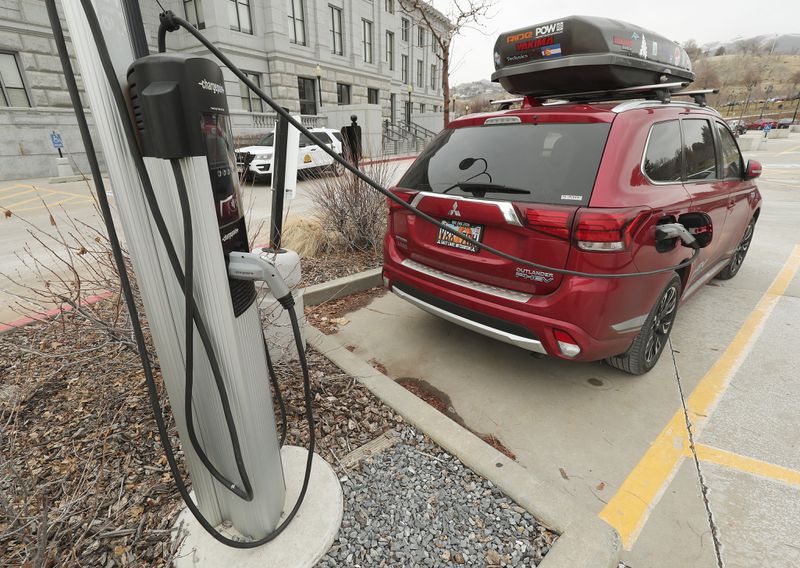 An electric vehicle is charged at the Capitol in Salt Lake City on Tuesday, Dec. 31, 2019. On New Year’s Day, Utah is becoming only the second state in the U.S., after Oregon, to roll
out an ongoing and fully operational "road user charge” program that electric and hybrid vehicle users can opt in to pay for the miles they drive measured by a device in their car.