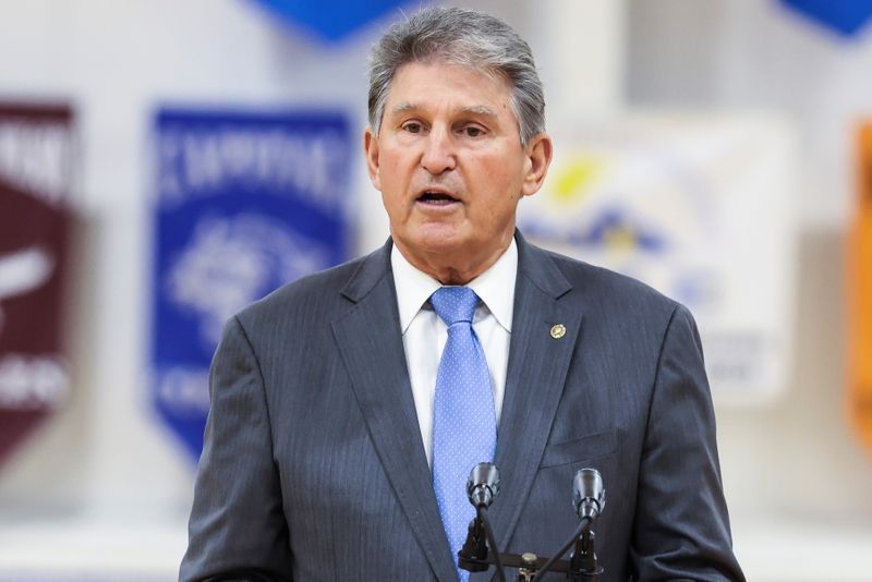FILE PHOTO: Sen. Joe Manchin, D-WV., speaks during a visit of U.S. first lady Jill Biden to a vaccination centre at Capital High School in Charleston, West Virginia, U.S., May 13, 2021.  Oliver Contreras/Pool via REUTERS