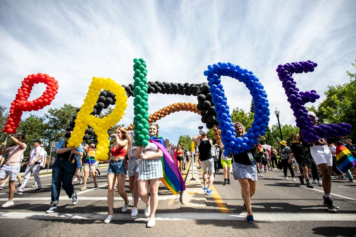 Participants carry balloons spelling out the word “Pride” during the Rainbow March and Rally that began at the state Capitol before heading to Liberty Park in Salt Lake City on Sunday, June 6, 2021.