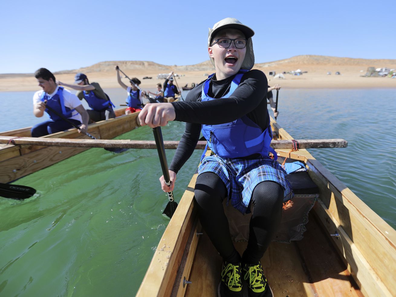 Landon Pearce, a visually impaired 10th grader at the
Utah Schools for the Deaf and the Blind, paddles with his team on
Lake Powell on March 27 during training for a 70-mile boat race.
The race in Washington state was cut short by rough water and
weather.