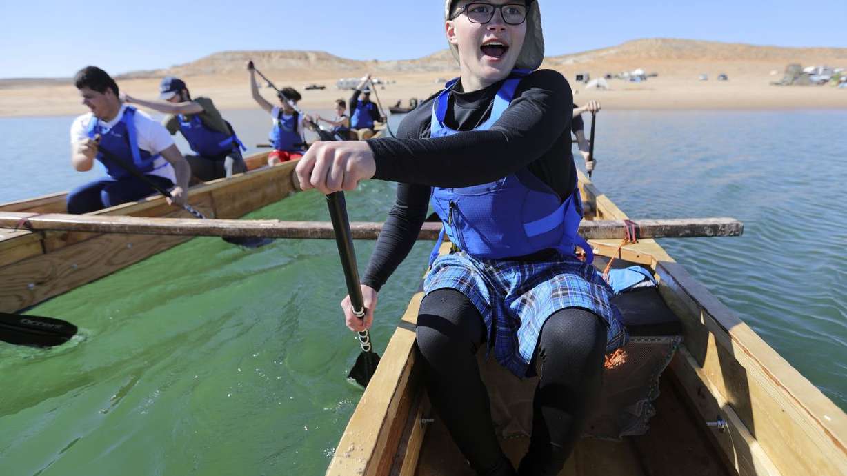Landon Pearce, a visually impaired 10th grader at the
Utah Schools for the Deaf and the Blind, paddles with his team on
Lake Powell on March 27 during training for a 70-mile boat race.
The race in Washington state was cut short by rough water and
weather.