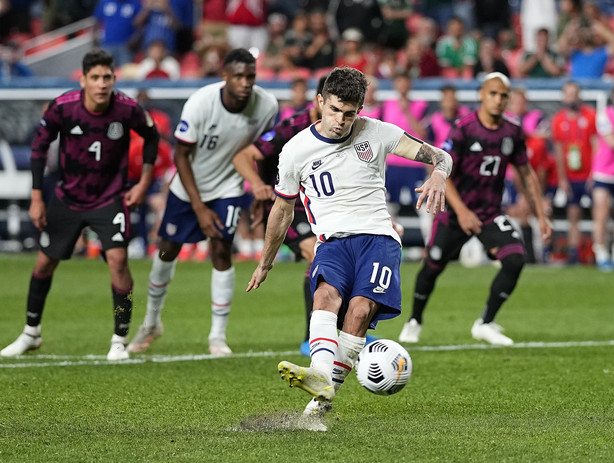 United States' Christian Pulisic (10) kicks a penalty kick for a goal against Mexico during extra time in the CONCACAF Nations League championship soccer match, Sunday, June 6, 2021, in Denver.