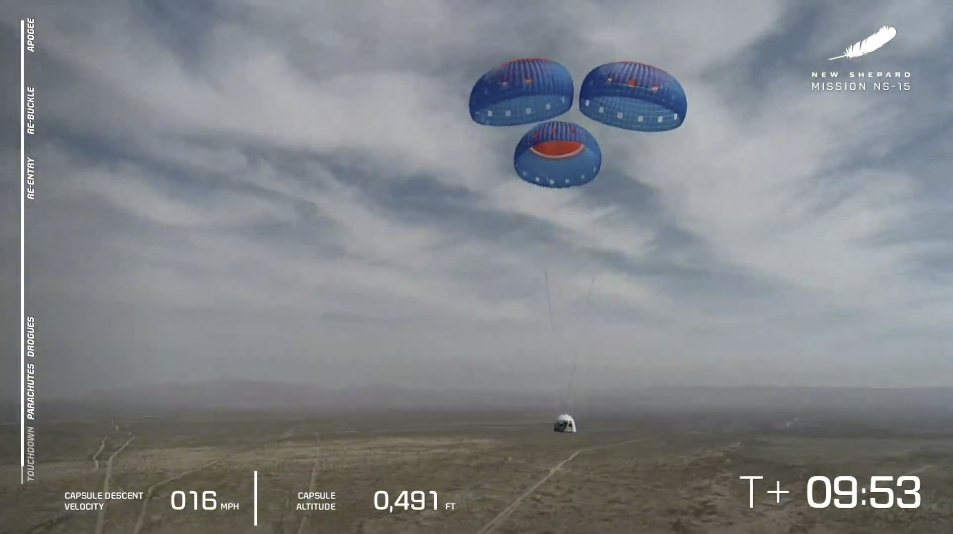 In this image from video made available by Blue Origin, the New Shepard capsule uses parachutes to land during a test in West Texas on Wednesday, April 14, 2021. Jeff Bezos will ride his own rocket into space next month, joining the first crew to fly Blue Origin.