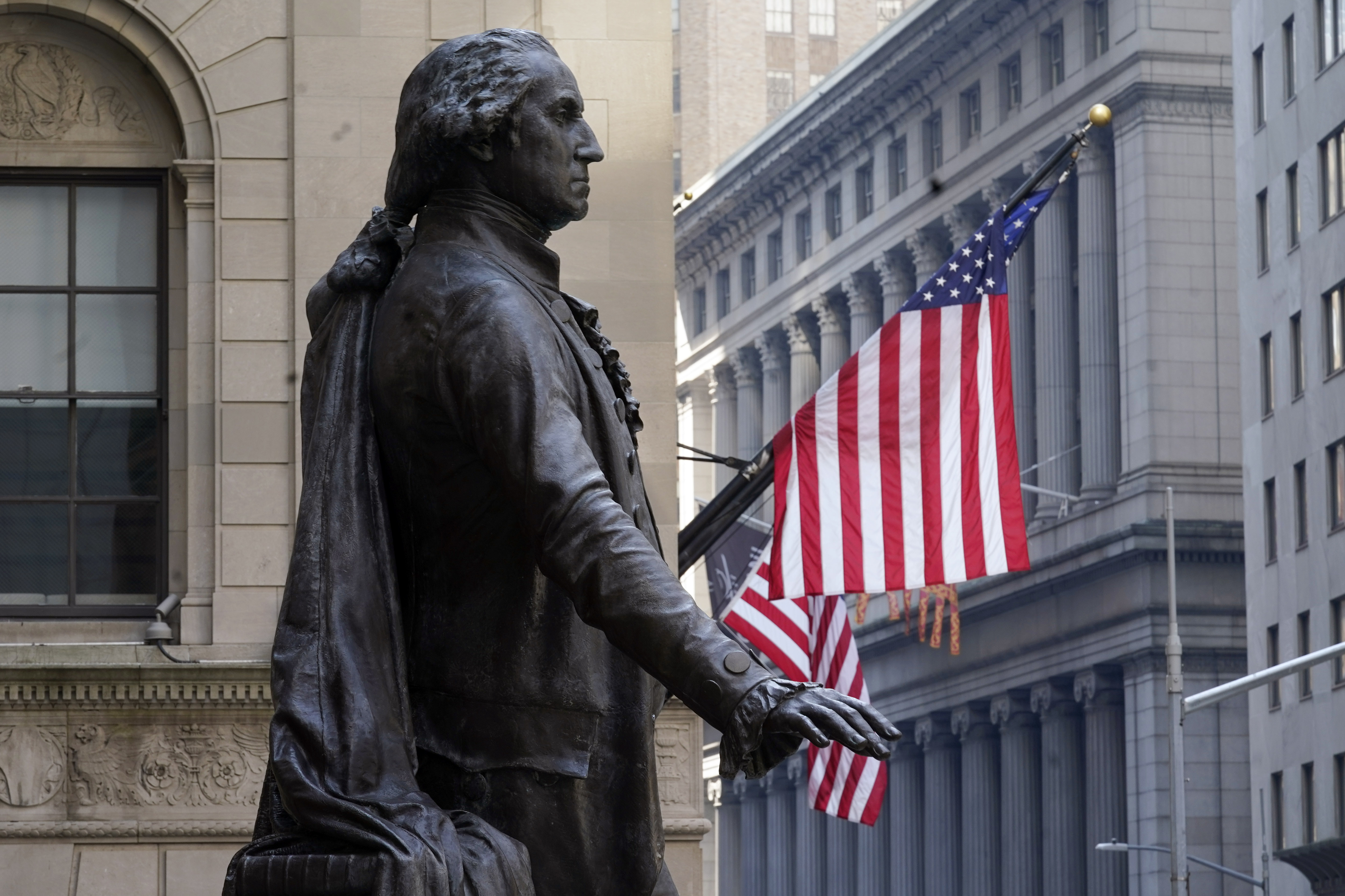 The Federal Hall statue of George Washington overlooks the New York Stock Exchange, Monday, June 7, 2021.