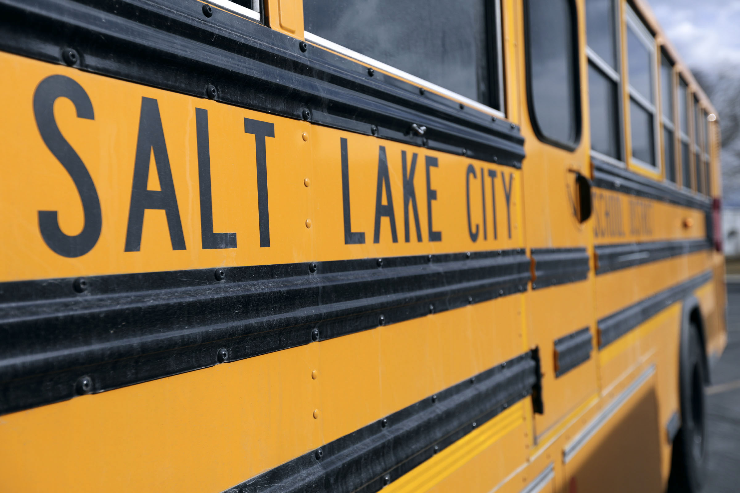 A school bus is parked in Salt Lake City on Thursday, Feb. 11, 2021. The Salt Lake City School District is seeking a new board member after one member resigned last week and was charged with object rape of a child.