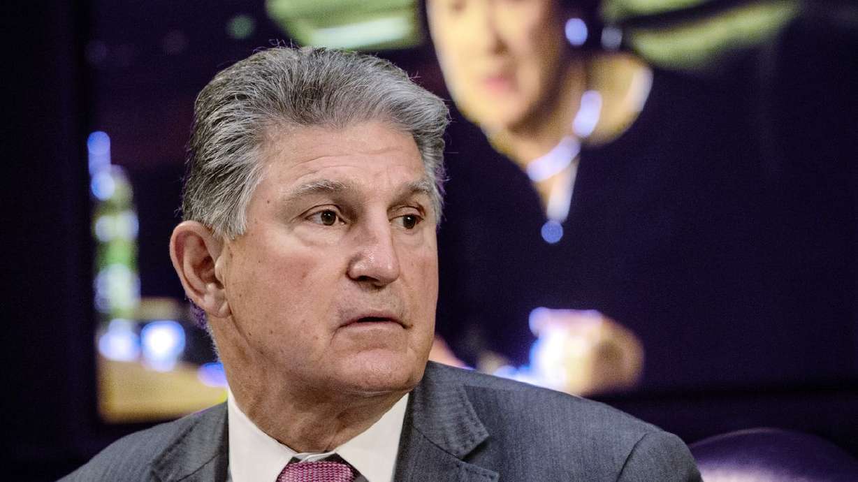 Sen. Joe Manchin, D-W.Va., listens as Sen. Susan
Collins, R-Maine, on the monitor behind him, asks questions during
a hearing on Capitol Hill in Washington on May 12, 2021. Manchin’s
opposition to the massive elections reform package likely dooms
legislation that a Utah senator has said was written by the "devil
himself.”