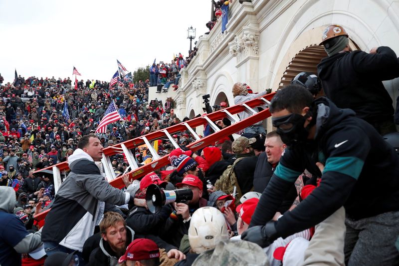 FILE PHOTO: Pro-Trump protesters storm into the U.S. Capitol during clashes with police, during a rally to contest the certification of the 2020 U.S. presidential election results by the U.S. Congress, in Washington, U.S, Jan. 6, 2021. REUTERS/Shannon Stapleton/File Photo