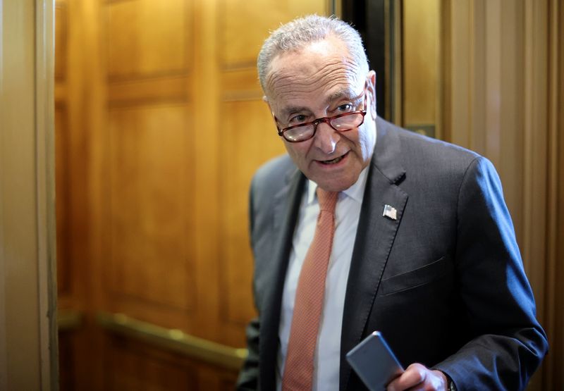 U.S. Senate Majority Leader Chuck Schumer (D-NY) speaks to a reporter about the status of a deal on infrastructure legislation as he departs the Senate floor at the U.S. Capitol in Washington, U.S., June 8, 2021. 