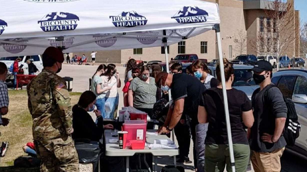 Area residents line up for a vaccine clinic at Uintah High School on Apr. 22, 2021.