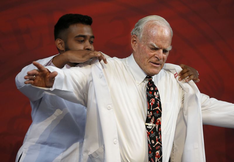 University of Utah medical student Sri Radhakrishnan helps Spencer Eccles with a lab coat stitched with the new name of the University of Utah’s School of Medicine — the Spencer Fox Eccles School of Medicine — following the announcement of a landmark gift to the U. in Salt Lake City on Wednesday, June 9, 2021. The gift from the George S. and Dolores Doré Eccles Foundation and the Nora Eccles Treadwell Foundation includes $30 million for a new home for the medical school.