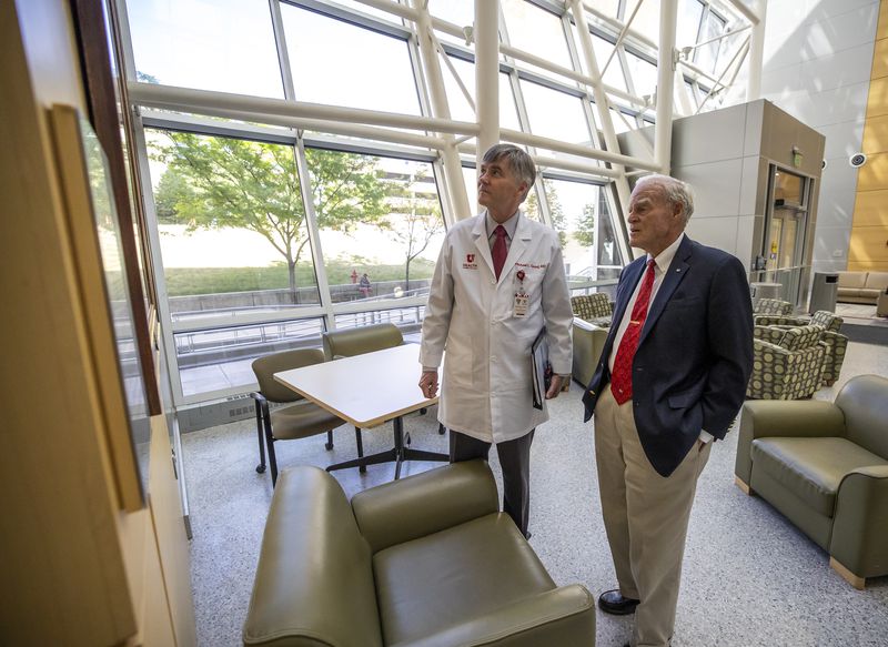 Dr. Michael L. Good, CEO of University of Utah Health and dean of the University of Utah School of Medicine, look at a photo of Spencer F. Eccles and his late wife, Cleone P. Eccles, inside the Eccles Health Sciences Education Building at the University of Utah on Tuesday, June 8, 2021. The University of Utah is announcing a landmark gift to its School of Medicine. The gift of $110 million from the George S. and Dolores Doré Eccles Foundation and the Nora Eccles Treadwell Foundation marks the largest gift ever made by the Eccles family to the university.