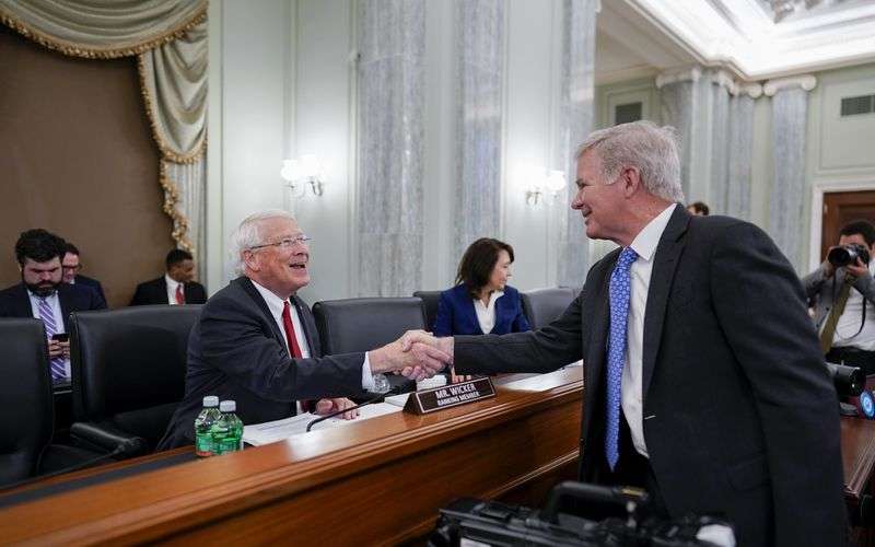 Sen. Roger Wicker, R-Miss., left, the ranking member of
the Senate Commerce, Science, and Transportation Committee, greets
NCAA President Mark Emmert as the panel prepares to hold a hearing
on student athlete compensation and federal legislative proposals
to enable athletes participating in collegiate sports to monetize
their name, image and likeness, at the Capitol in Washington on
Wednesday, June 9, 2021.