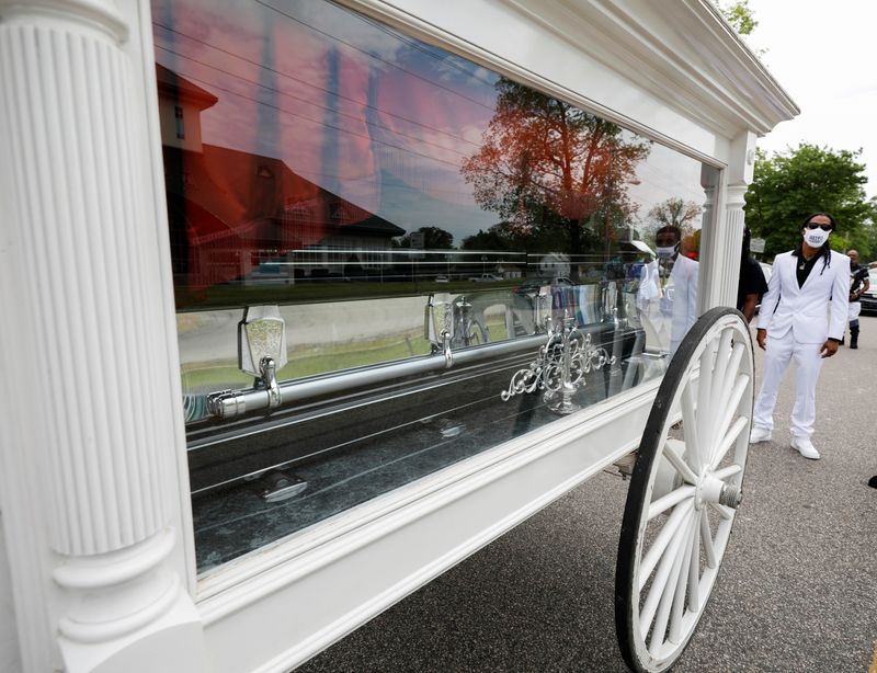 FILE PHOTO: Khalil Ferebee, the son of Andrew Brown Jr., stands behind his father's casket after it was loaded into a horse-drawn cart bound for the funeral in Elizabeth City, North Carolina, U.S. May 3, 2021. REUTERS/Jonathan Drake