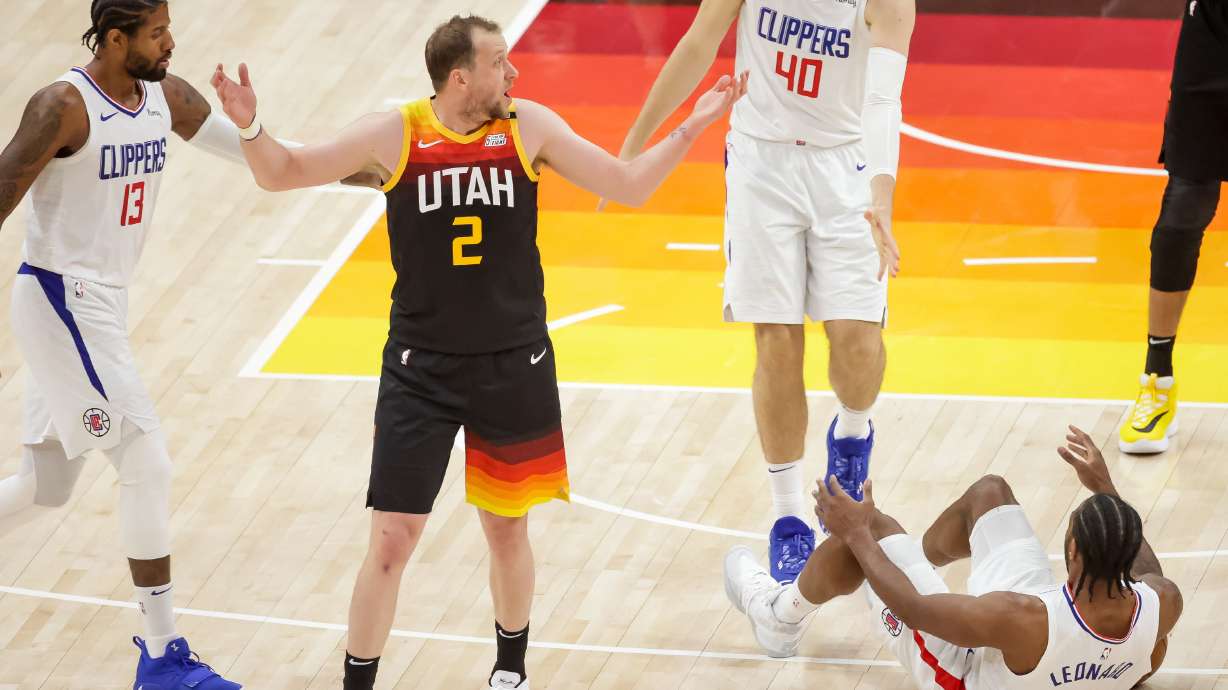 Utah Jazz guard Joe Ingles (2) reacts to a foul call as LA Clippers forward Kawhi Leonard (2) hits the floor during Game 1 of the Western Conference semifinals at Vivint Arena in Salt Lake City on Tuesday, June 8, 2021.