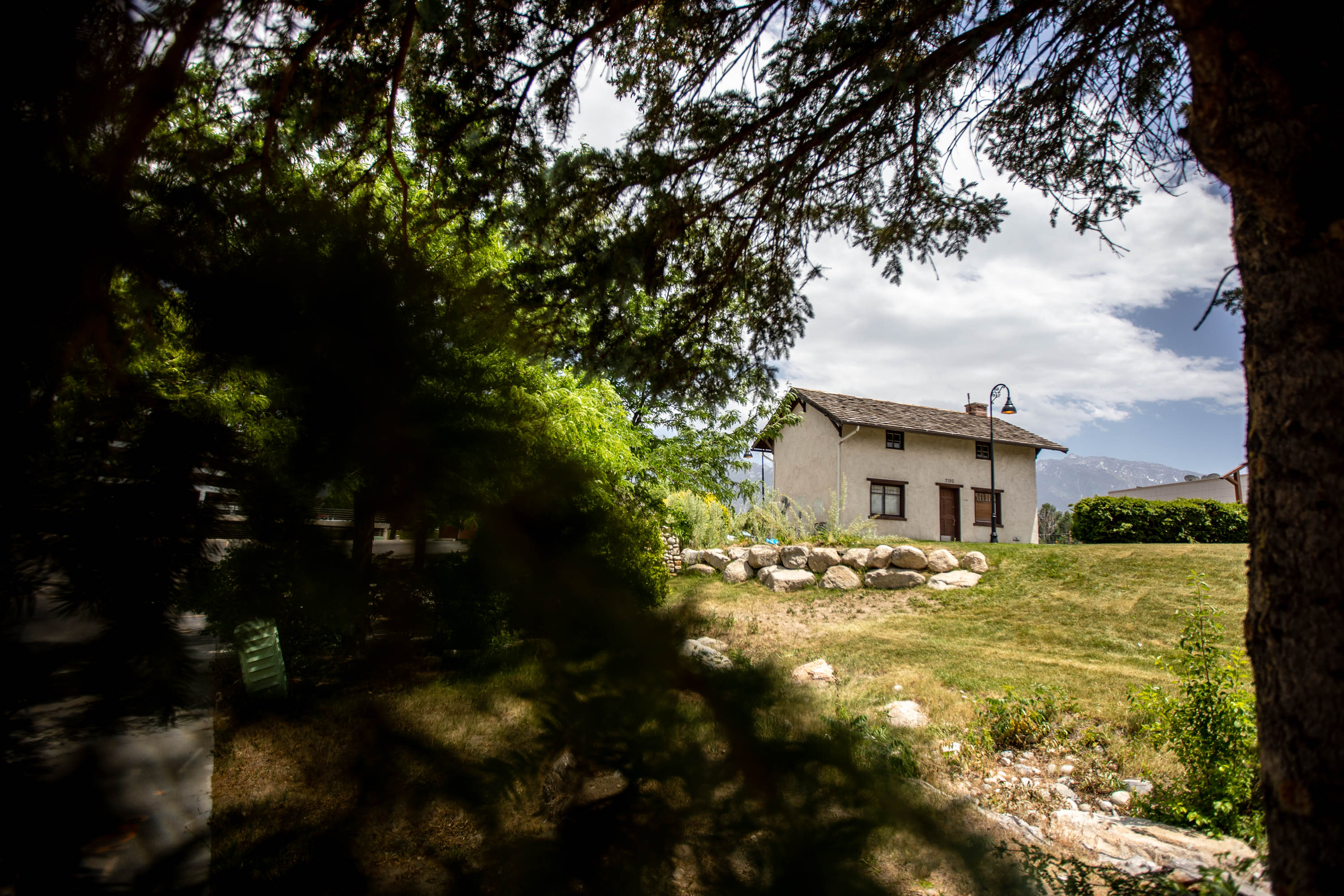 The replica Jehu Cox home sits on an acre of grass across the street from Walmart in Midvale at the Fort Union shopping center on Thursday, June 10, 2021. The owners of the center propose building apartments in the area. 