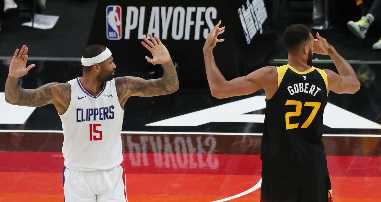LA Clippers center DeMarcus Cousins (15) and Utah Jazz center Rudy Gobert (27) complain to the ref during the NBA playoffs in Salt Lake City on Thursday, June 10, 2021. The Jazz won 117-111.