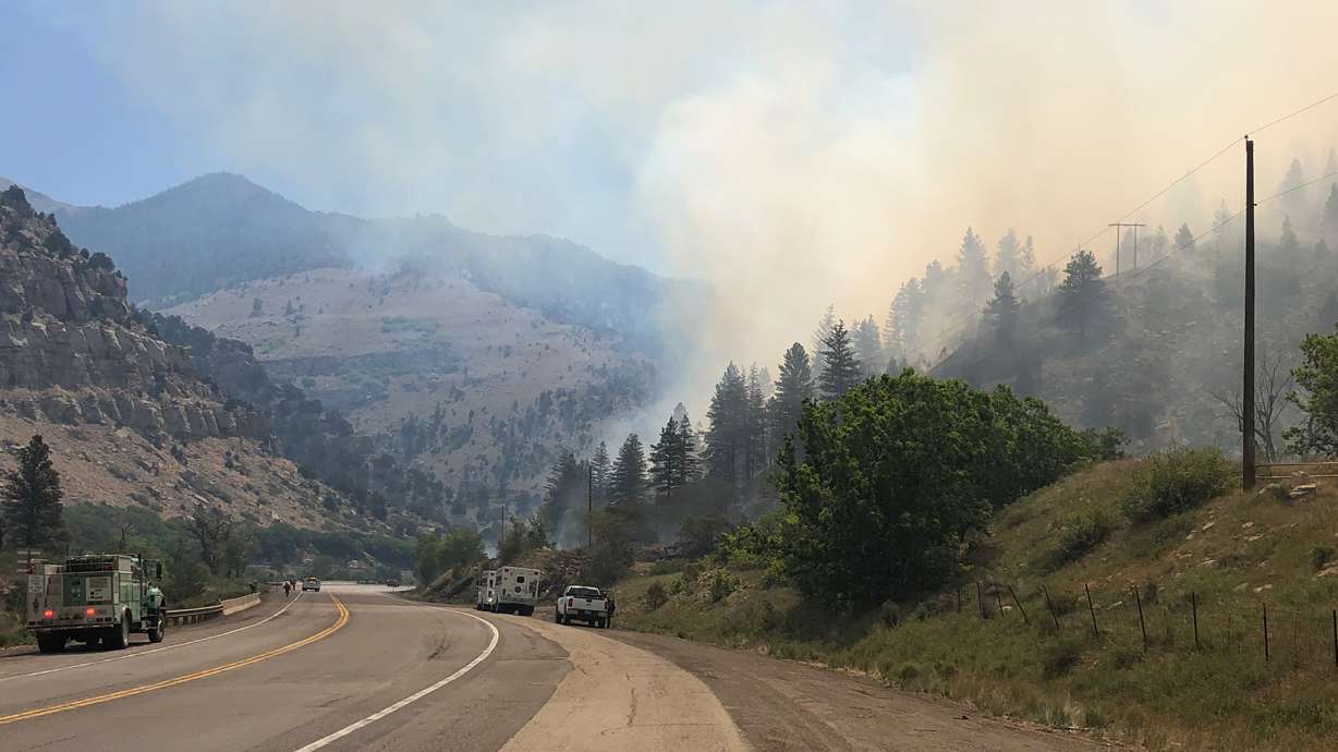 Firefighters are seen fighting the Bear Fire, burning 4 miles northwest of Helper in Carbon County, on Thursday, June 10, 2021.