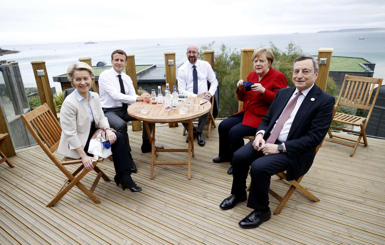From left, European Commission President Ursula von der Leyen, French President Emmanuel Macron, European Council President Charles Michel, German Chancellor Angela Merkel and Italy's Prime Minister Mario Draghi gather for an EU coordination meeting prior to the G7 meeting at the Carbis Bay Hotel in Carbis Bay, St. Ives, Cornwall, England, Friday, June 11, 2021.