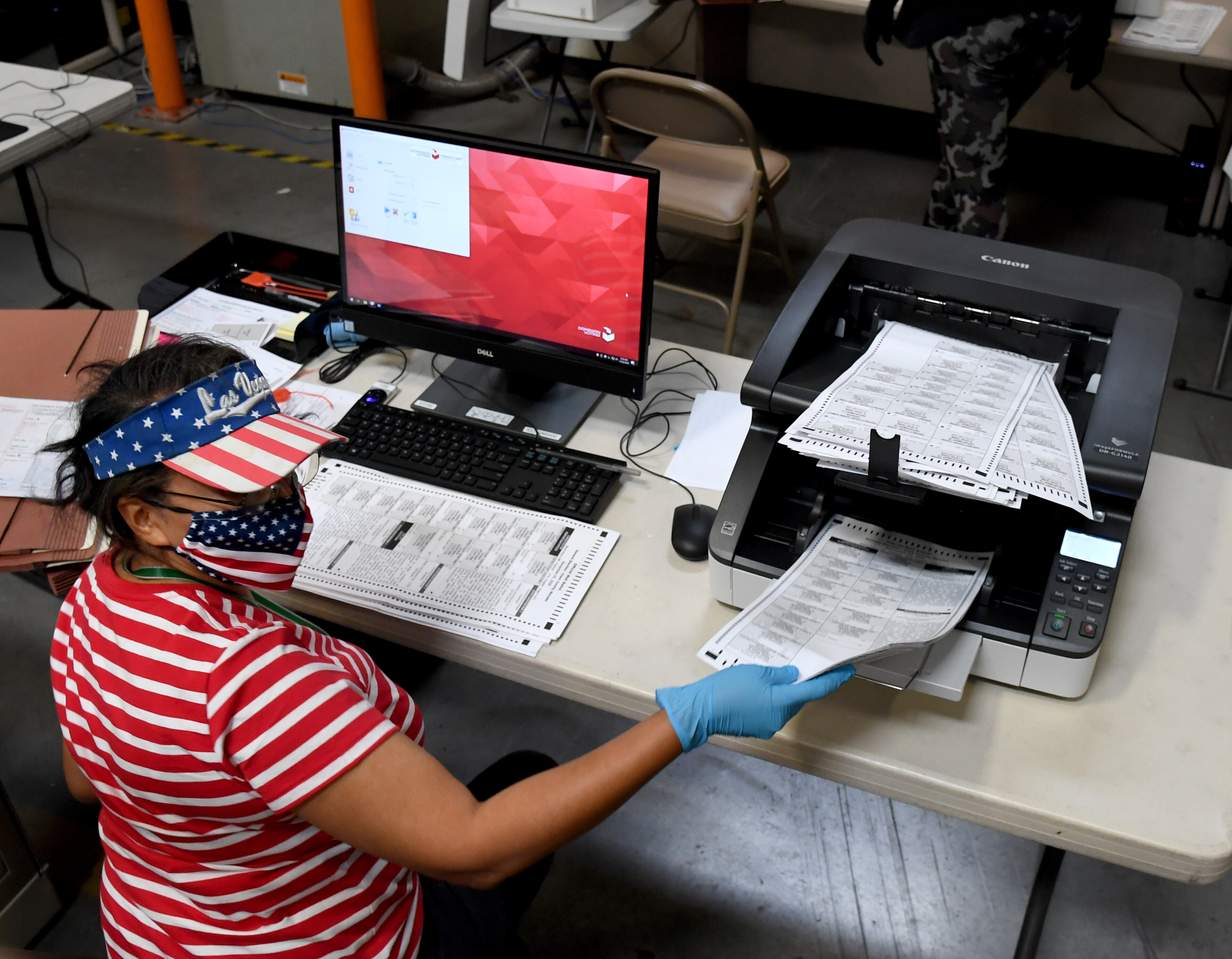 Gov. Steve Sisolak signed a law that moves its party presidential selection contest up to the first Tuesday in February in 2024 and changes it from a caucus to a primary. Pictured, a Clark County election worker on October 20, 2020 in North Las Vegas, Nevada.