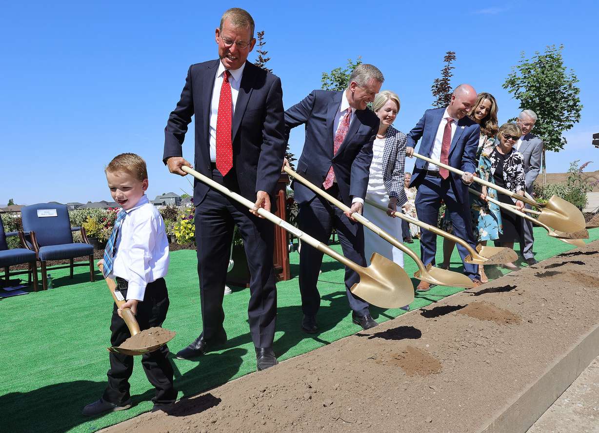 Emmett Thayne, 5, grandson to Mark S. Thayne, joins Elder Kevin R. Duncan, third from left, in turning over soil during groundbreaking for the Syracuse Utah Temple of The Church of Jesus Christ of Latter-day Saints in Syracuse on Saturday, June 12, 2021.