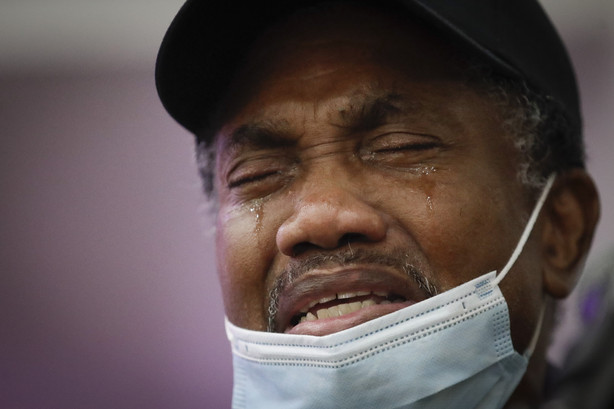 In this July 21, 2020, file photo, Samuel Nunez cries as he eulogizes his daughter Lydia Nunez, who died from COVID-19, during a funeral service in memory of her at the Metropolitan Baptist Church in Los Angeles.