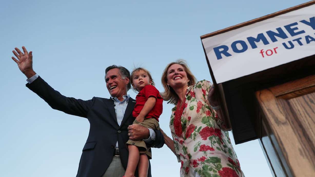 Mitt Romney, with his wife, Ann, and their youngest grandson, Dane, wave to the crowd at the Republican primary for U.S. Senate in Orem in 2018. A mother of five sons, Ann Romney is taking issue with the Biden
administration’s use of the term "birthing person” in its federal budget proposal.