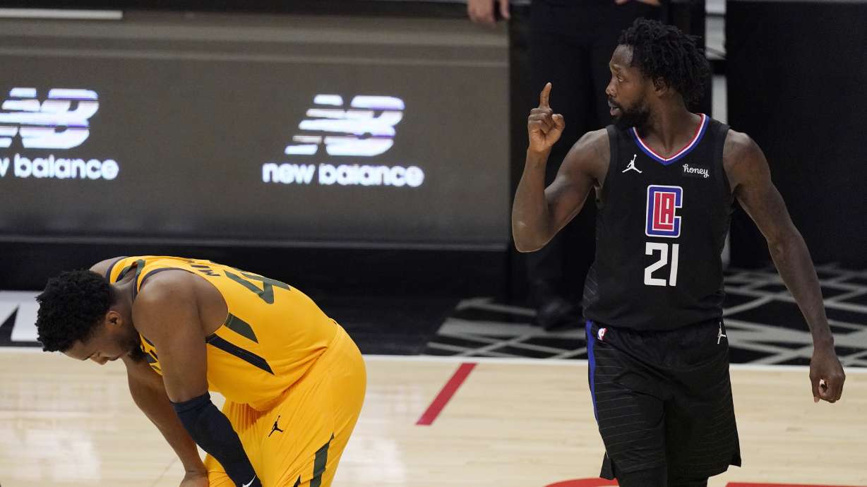 Los Angeles Clippers guard Patrick Beverley, right, gestures after a foul that was committed by the Utah Jazz as the Jazz's guard Donovan Mitchell looks down during the second half in Game 4 of a second-round NBA basketball playoff series Monday, June 14, 2021, in Los Angeles.