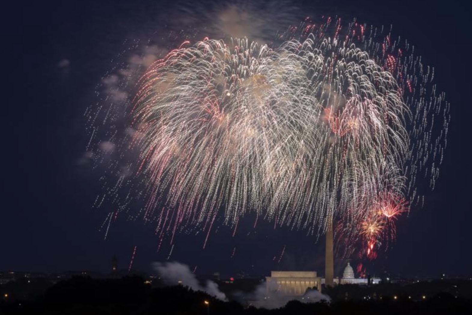 Fourth of July fireworks explode over the Lincoln Memorial, the Washington Monument and the U.S. Capitol along the National Mall in Washington, Saturday, July 4, 2020. President Joe Biden wants to imbue Independence Day with new meaning in 2021 by encouraging nationwide celebrations to mark the country’s effective return to normalcy after 16 months of pandemic disruption.