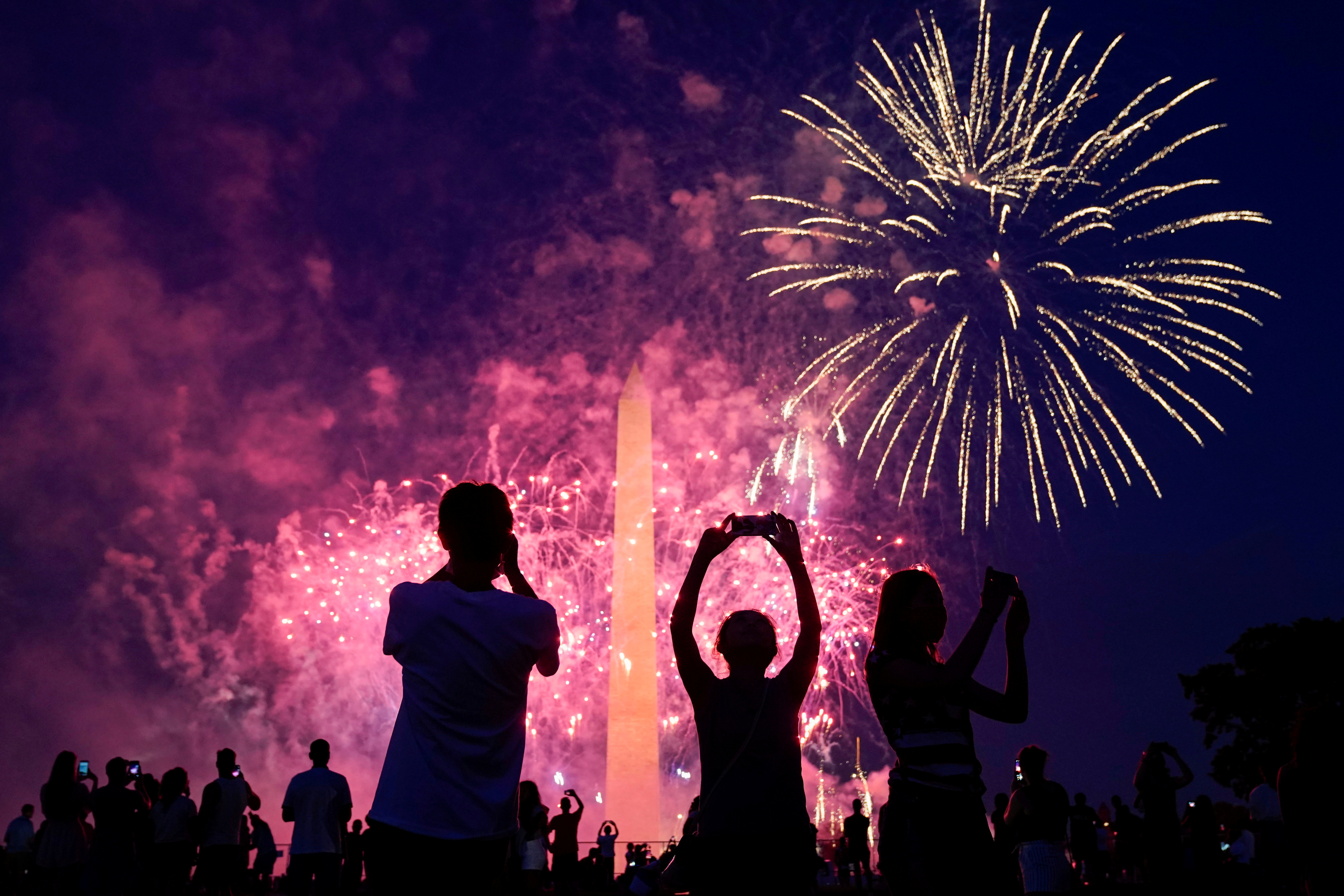 People watch the fireworks at the Washington Monument during Independence Day celebrations in Washington, U.S., July 4, 2020.