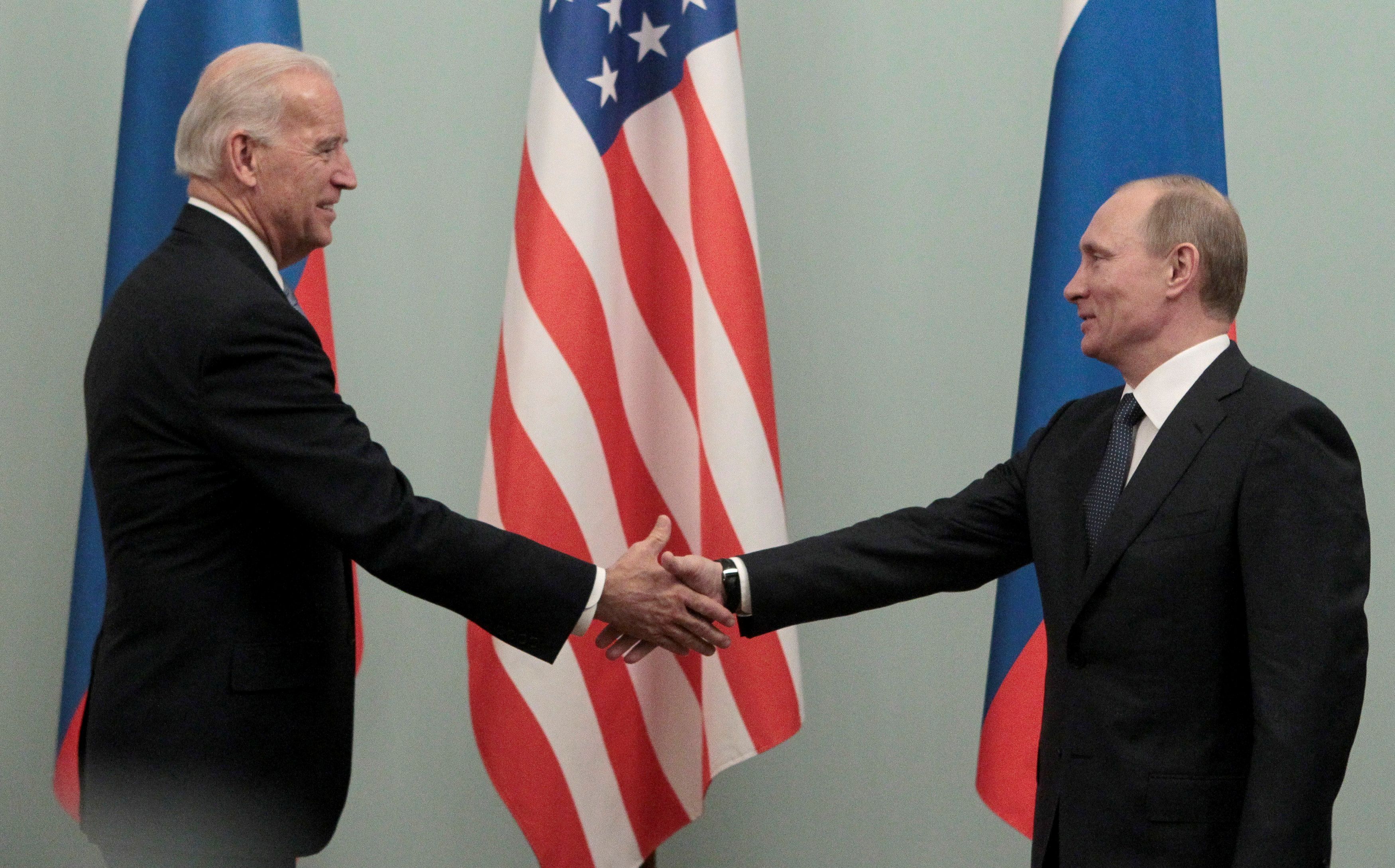 Russian Prime Minister Vladimir Putin (R) shakes hands with U.S. Vice President Joe Biden during their meeting in Moscow on March 10, 2011. They are set to meet again on Wednesday in Geneva.