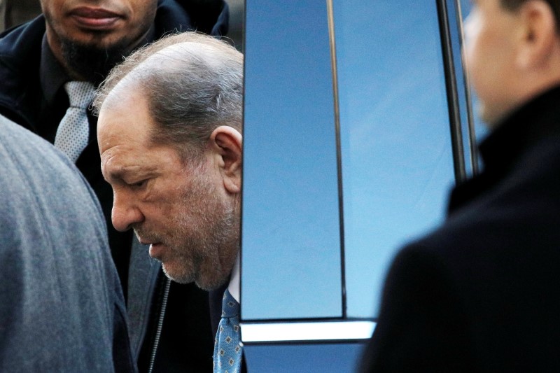 FILE PHOTO: Film producer Harvey Weinstein arrives at New York Criminal Court ahead of the fifth day of jury deliberations for his sexual assault trial in the Manhattan borough of New York City, New York, U.S., February 24, 2020. REUTERS/Andrew Kelly/File Photo