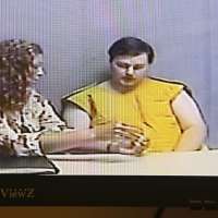 Iowa man charged with killing family blamed masked intruder