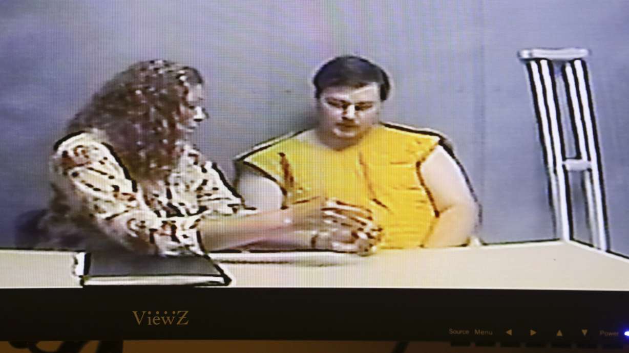 Iowa man charged with killing family blamed masked intruder